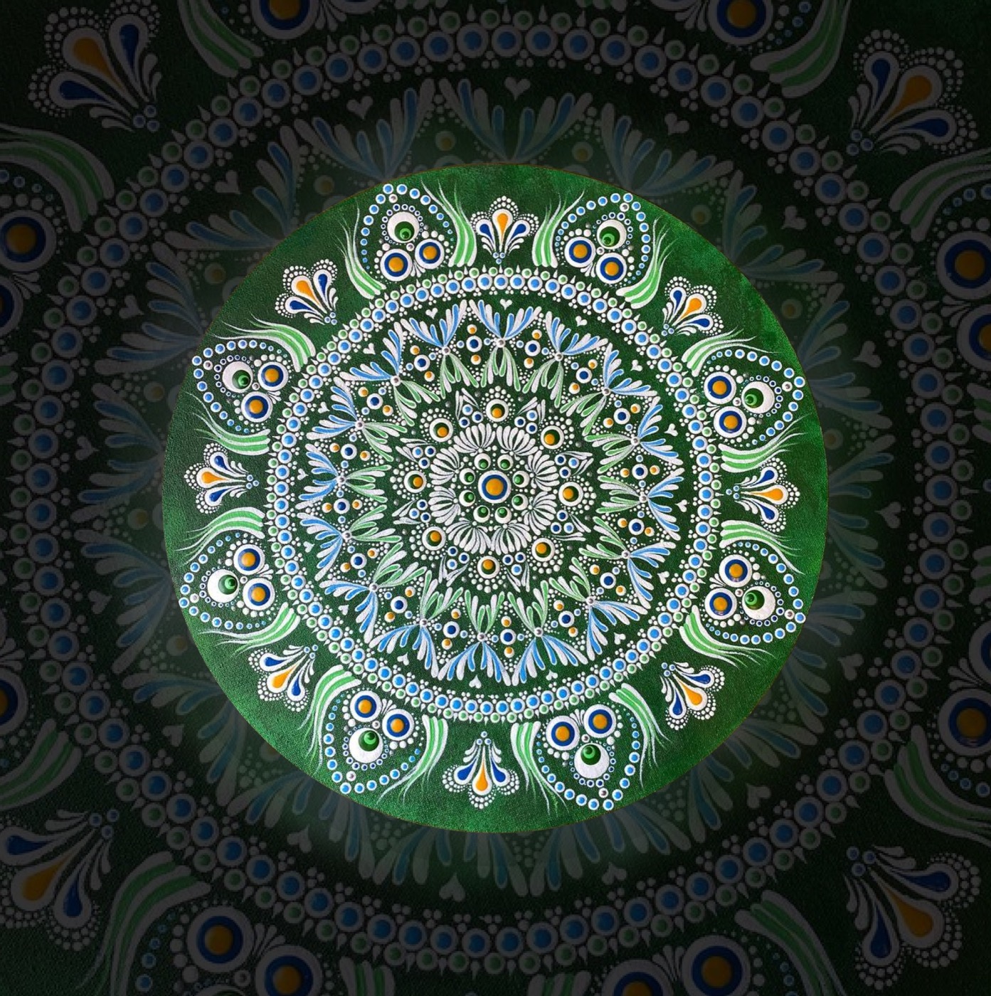 A green circular mandala with white and blue details